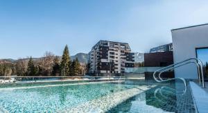 a swimming pool on top of a building at Silver Fox Residence in Poiana Brasov