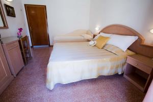 Postel nebo postele na pokoji v ubytování Hotel Villa Sole Resort
