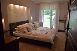 Ένα ή περισσότερα κρεβάτια σε δωμάτιο στο Apartamenty Bukowa Wisła