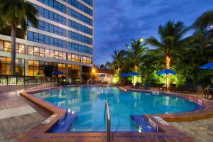 a large swimming pool in front of a building at Holiday Inn Miami West - Airport Area by IHG in Hialeah Gardens