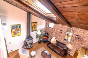 an overhead view of a living room with a brick wall at Loft 60 - EXCLUSIVE LOFT ROME CITY CENTER in Rome