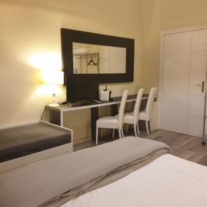 Postel nebo postele na pokoji v ubytování Rigoletto Rental Rooms