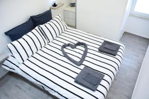 Кровать или кровати в номере Corte32