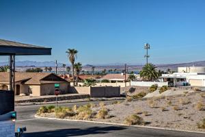 a street with a stop sign in the desert at 4 Mi to Beach Lake Havasu Apartment with Pool! in Lake Havasu City