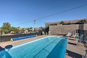 a swimming pool in a yard with a fence at 4 Mi to Beach Lake Havasu Apartment with Pool! in Lake Havasu City