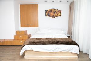 מיטה או מיטות בחדר ב-Vila Elisabeta