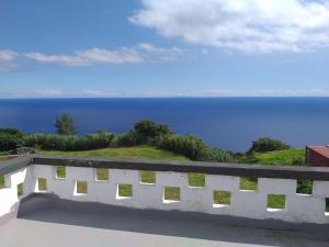 a view of the ocean from the balcony of a house at Casa da Lomba do Cavaleiro in Povoação