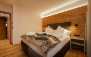 Posteľ alebo postele v izbe v ubytovaní NATURPARKGUT - alpdeluxe Apartments