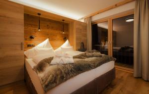Posteľ alebo postele v izbe v ubytovaní NATURPARKGUT - alpdeluxe Apartments