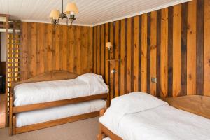 Postel nebo postele na pokoji v ubytování Del Pescador Hotel Cabañas