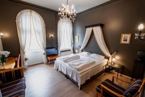 Postel nebo postele na pokoji v ubytování Grand Hotel Hønefoss
