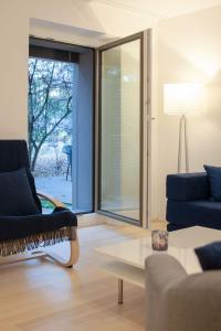 Khu vực ghế ngồi tại 2,5 Zi Design Loft Wohnung mit Gartensitzplatz