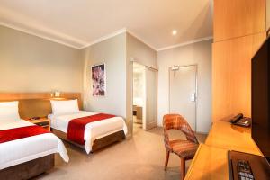 Postel nebo postele na pokoji v ubytování BEST WESTERN PLUS Travel Inn