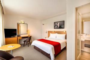 Postel nebo postele na pokoji v ubytování BEST WESTERN PLUS Travel Inn