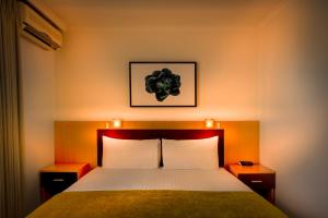 Postel nebo postele na pokoji v ubytování BEST WESTERN PLUS Travel Inn