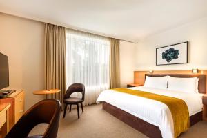 Postel nebo postele na pokoji v ubytování BEST WESTERN PLUS Travel Inn
