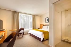 Postel nebo postele na pokoji v ubytování BEST WESTERN PLUS Travel Inn