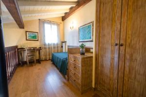 Postel nebo postele na pokoji v ubytování Corte Del Passone