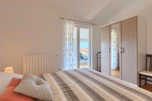 Postel nebo postele na pokoji v ubytování Apartments Boris