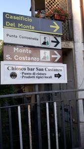 a group of signs on the side of a building at Emidio House in Termini