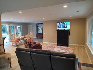 a living room with a couch and a television at C&D Luvmarshview LLC in Beaufort