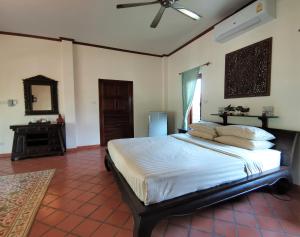 Cama ou camas em um quarto em Tuna Resort