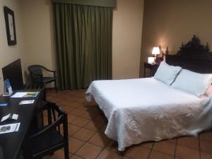A bed or beds in a room at Los Bronces