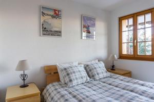 מיטה או מיטות בחדר ב-Chalet le Joyau