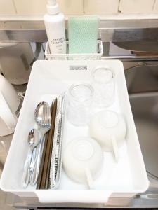 a white tray with utensils on it in a kitchen at ラ・ポート空港前201 in Fukuoka