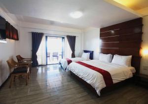 Voodi või voodid majutusasutuse Manarra Sea View Resort toas