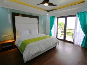 Voodi või voodid majutusasutuse Manarra Sea View Resort toas
