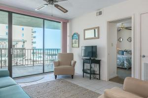 a living room with a couch and a television at Gulf Village #215 in Gulf Shores