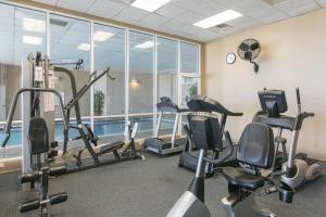 a gym with cardio equipment and a swimming pool at Admirals Quarters in Orange Beach