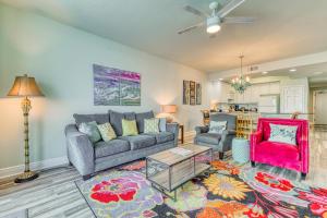 a living room with two couches and a table at San Carlos #1808 in Gulf Shores