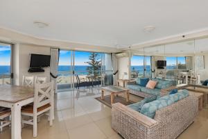 a living room with a view of the ocean at Points North Apartments in Gold Coast