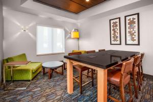 a dining room with a table and chairs at Holiday Inn Express Hotel & Suites Cleveland-Richfield by IHG in Brecksville