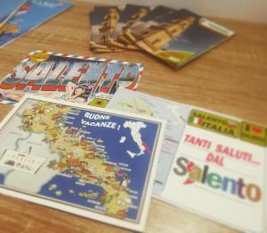 a table with some games and books on it at Rosita Rooms in Lecce
