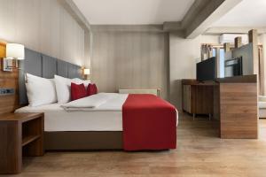 Postel nebo postele na pokoji v ubytování Ramada by Wyndham Van