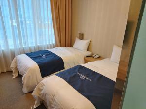 Postel nebo postele na pokoji v ubytování Incheon Aiport Airrelax hotel