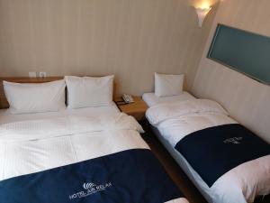 Postel nebo postele na pokoji v ubytování Incheon Aiport Airrelax hotel