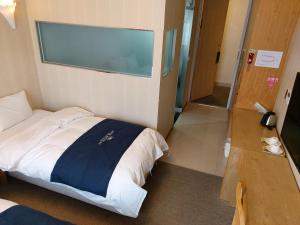 Postel nebo postele na pokoji v ubytování Incheon Aiport Airrelax hotel