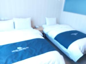 Postel nebo postele na pokoji v ubytování Incheon Aiport Airrelax hotel