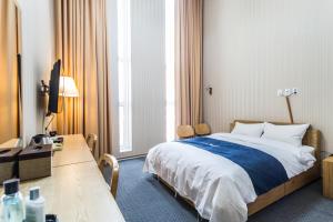 Postel nebo postele na pokoji v ubytování Incheon Aiport Airrelax hotel