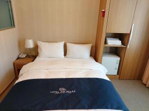 Postel nebo postele na pokoji v ubytování Incheon Aiport Airrelax hotel