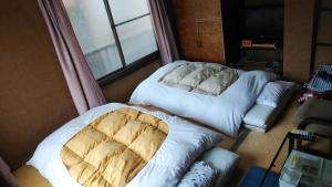 Katil atau katil-katil dalam bilik di Walking Pilgrimage Hotel Tokiwa Ryokan