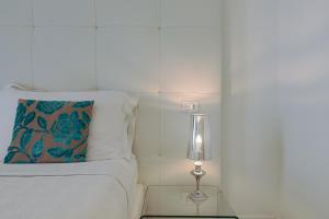 Postel nebo postele na pokoji v ubytování Palco Rooms&Suites