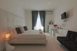 TV a/nebo společenská místnost v ubytování Palco Rooms&Suites