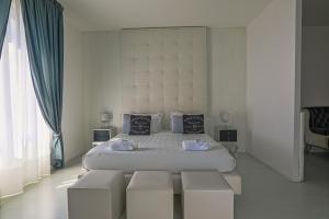 Postel nebo postele na pokoji v ubytování Palco Rooms&Suites + 37 fotografií