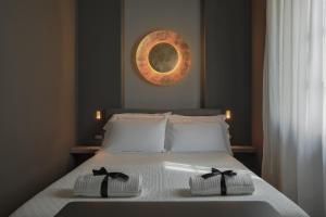 Postel nebo postele na pokoji v ubytování Palco Rooms&Suites