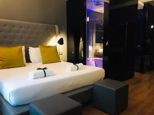 Postel nebo postele na pokoji v ubytování Palco Rooms&Suites